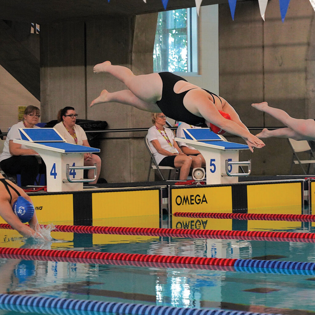 Casey mid dive into the swimming pool